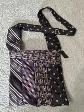 Necktie purse adjustable shoulder to cross-body. Zipper closure , interior pocket with zipper closure